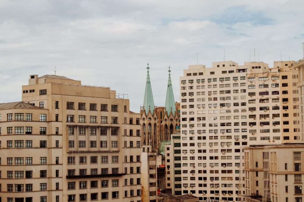 View of São Paulo skyline featuring the iconic Metropolitan Cathedral amidst urban structures.